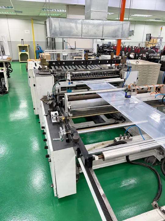 Bag-making machine converting clear film into bags